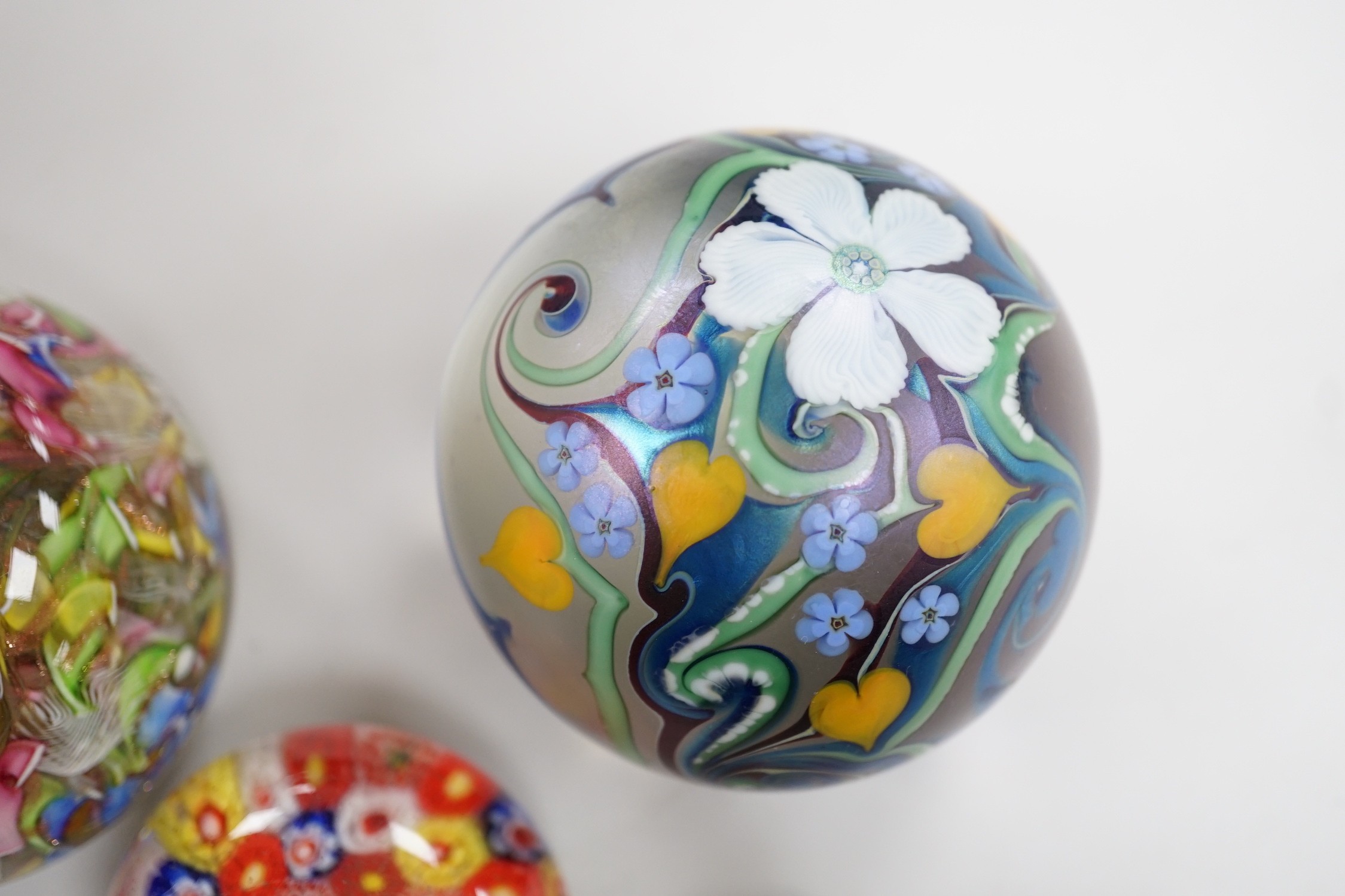 An Orient and Flume glass paperweight, a Venetian scrambled glass paperweight, and three Chinese paperweights, largest 7cm tall